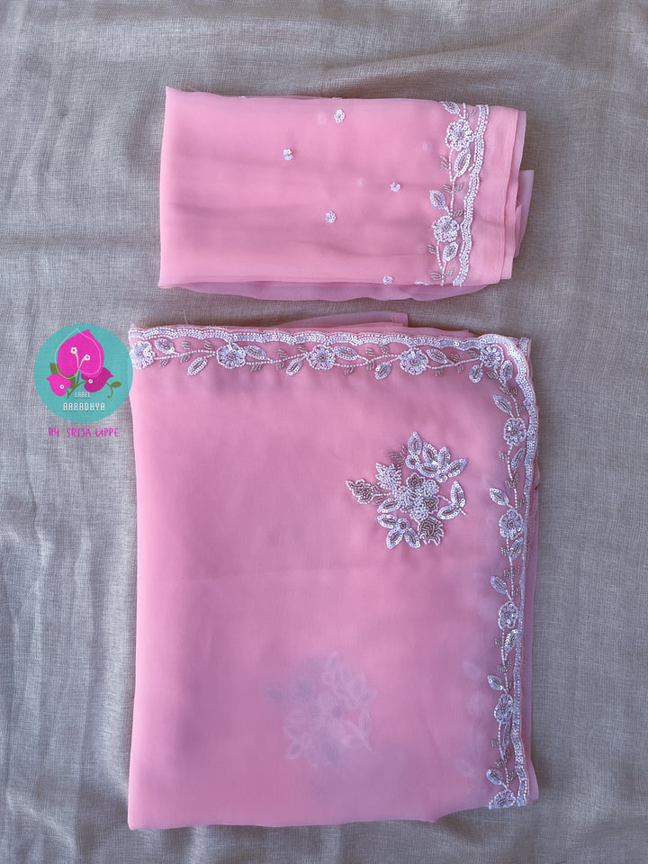 Hand embroidered georgette pink saree