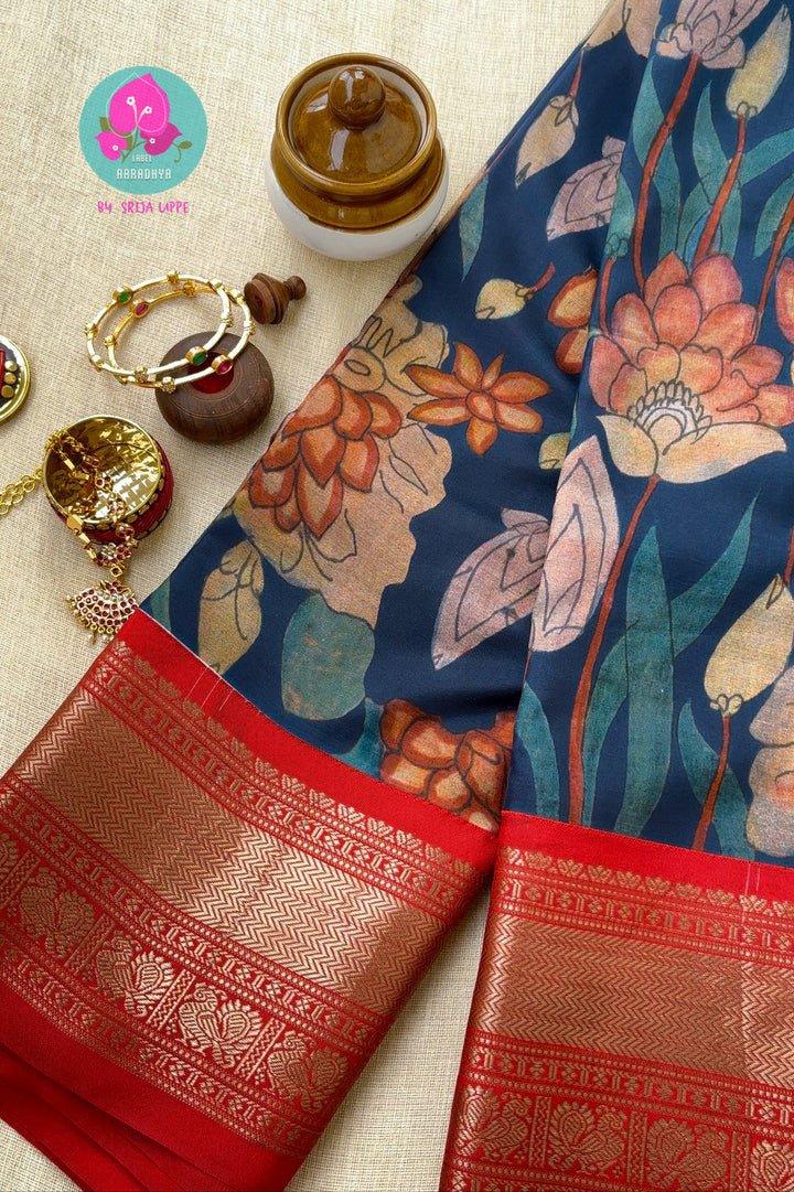 Blue kalamkari printed saree with red border