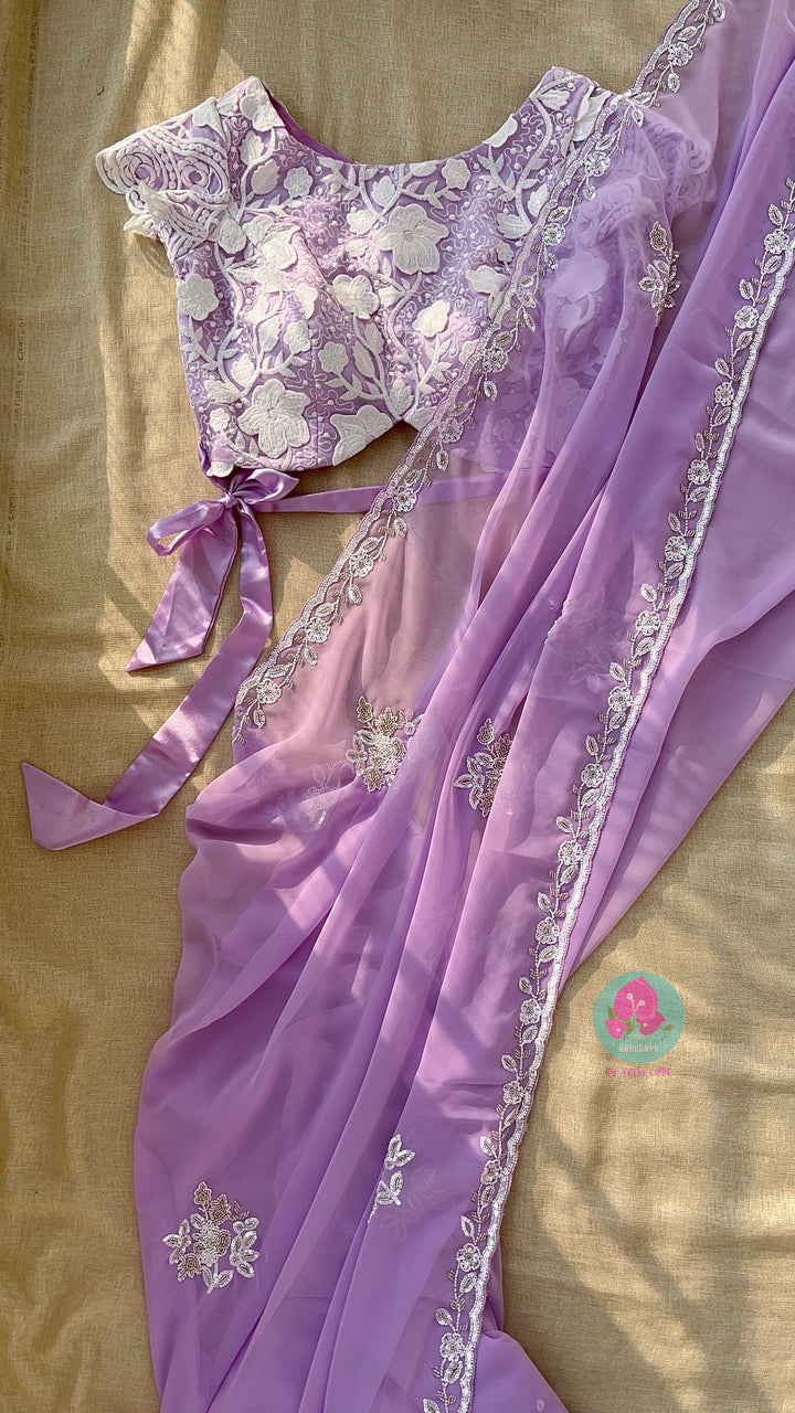 Hand embroidered georgette lavender saree with Embroidered net blouse