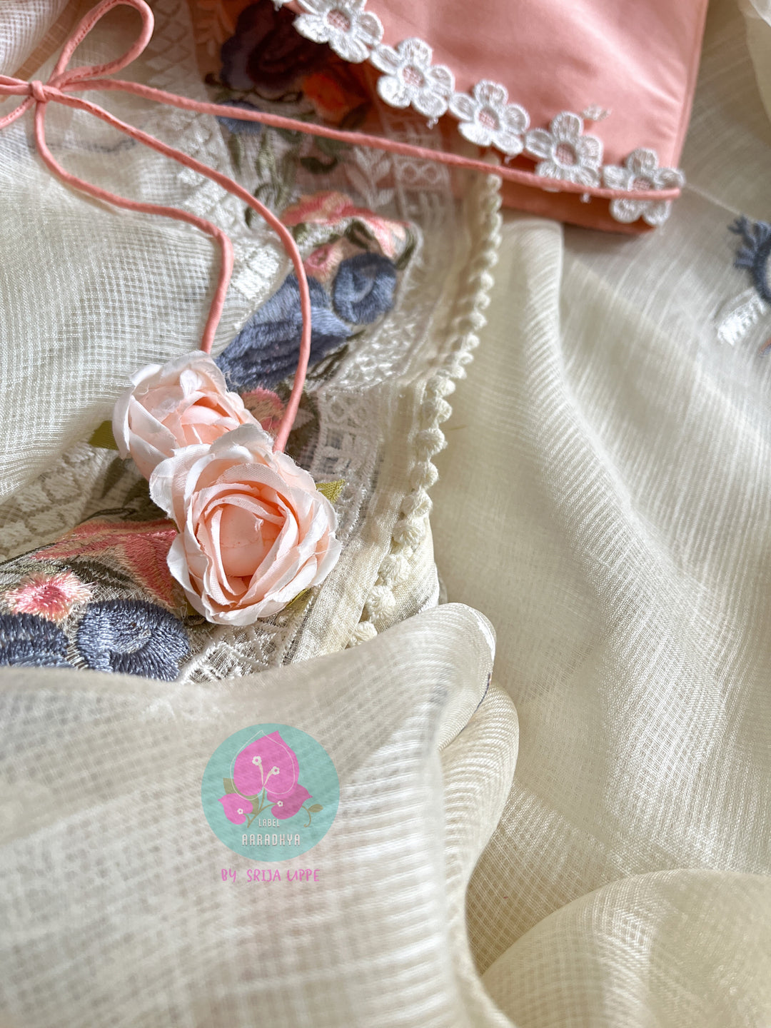 Pure tussar kota saree with beautiful flamingos paired with lace detailing peach blouse