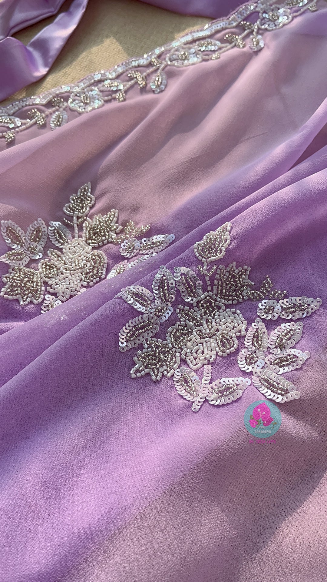 Hand embroidered georgette lavender saree with Embroidered net blouse