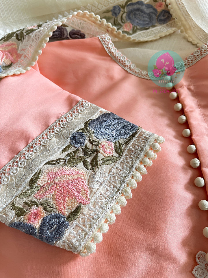 Pure tussar kota saree with beautiful flamingos paired with lace detailing peach blouse