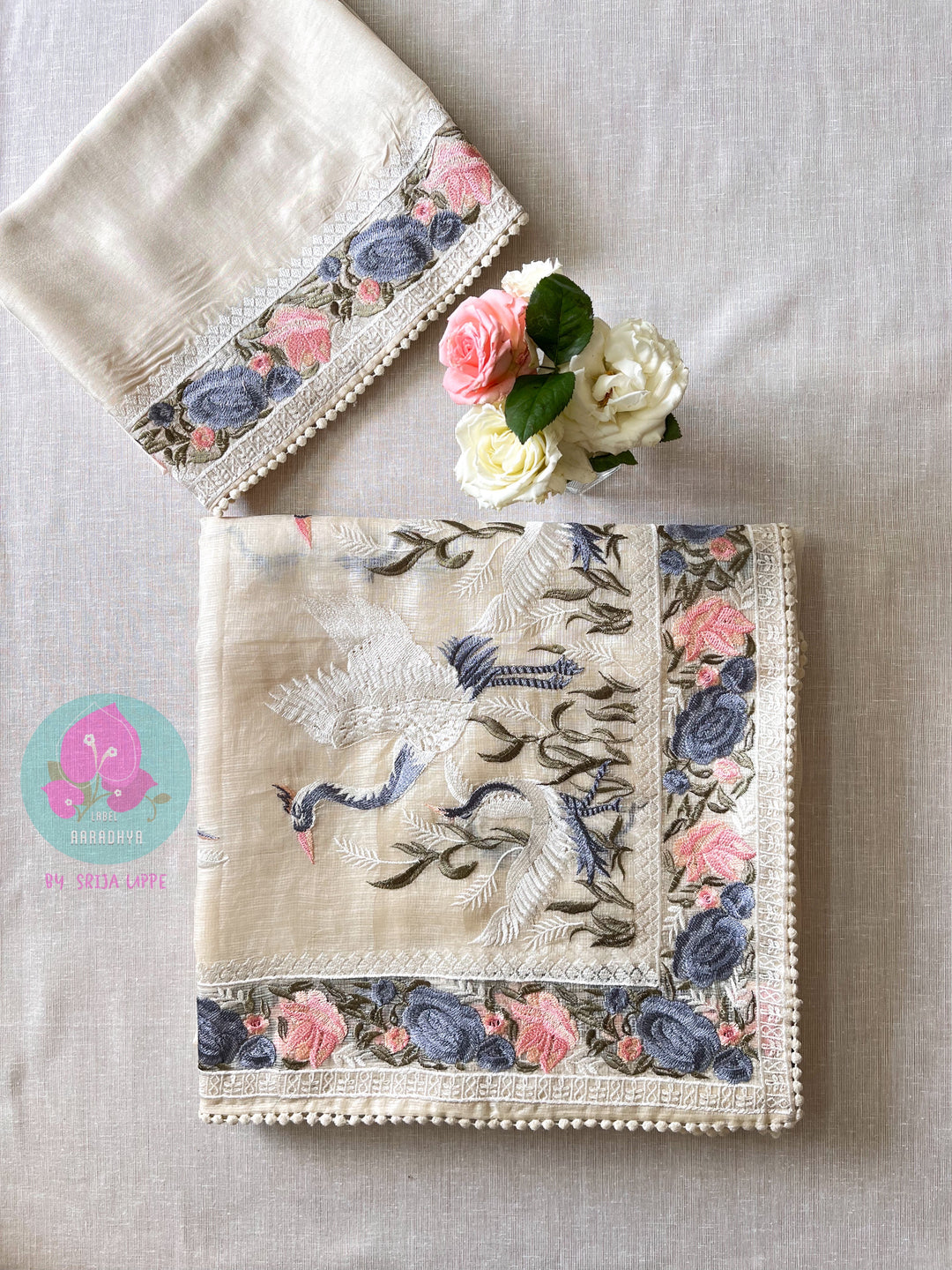 Pure tussar kota saree with beautiful flamingos paired with lace detailing peach blouse