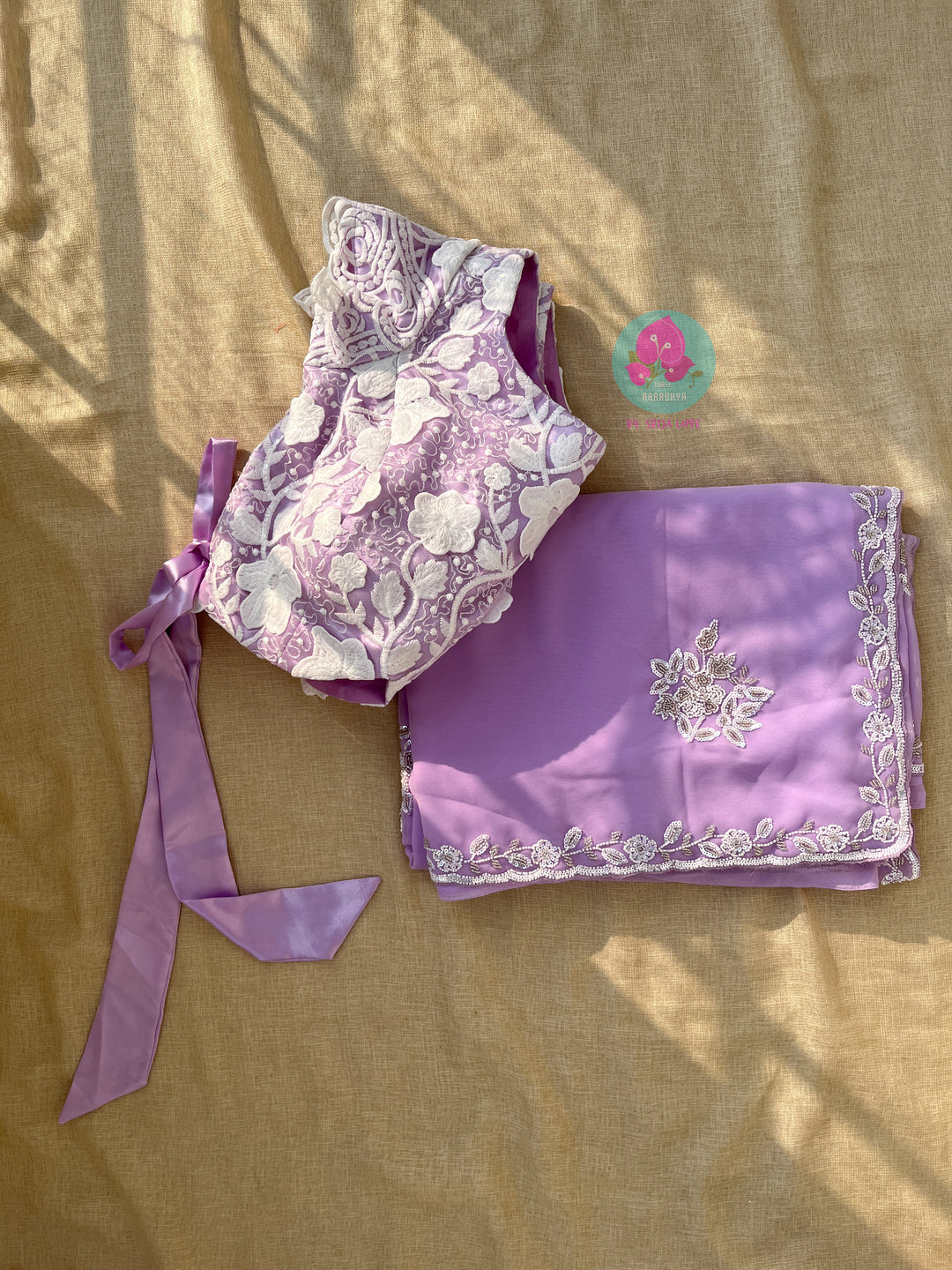Hand embroidered georgette lavender saree with Embroidered net blouse