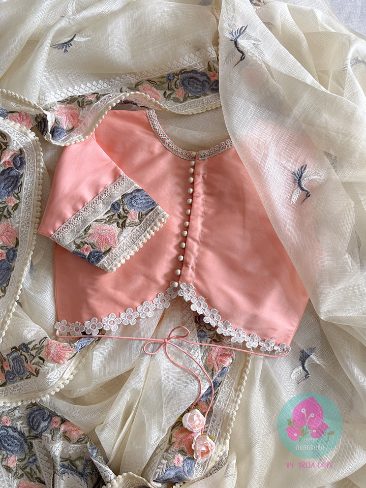Pure tussar kota saree with beautiful flamingos paired with lace detailing peach blouse