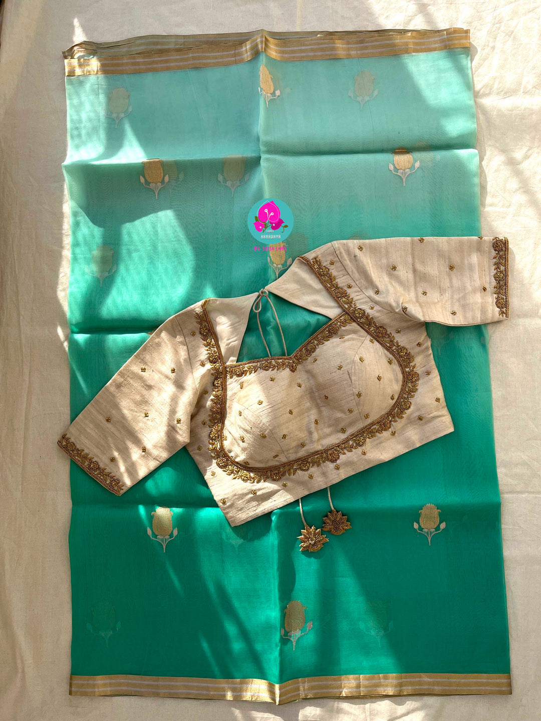 Pure Benarasi Kora organza saree with hand embroidered pure rawsilk blouse in Madhubala pattern.
