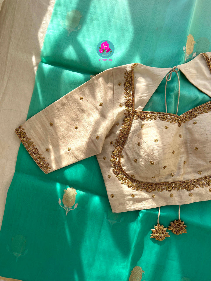 Pure Benarasi Kora organza saree with hand embroidered pure rawsilk blouse in Madhubala pattern.