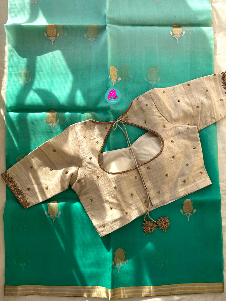 Pure Benarasi Kora organza saree with hand embroidered pure rawsilk blouse in Madhubala pattern.
