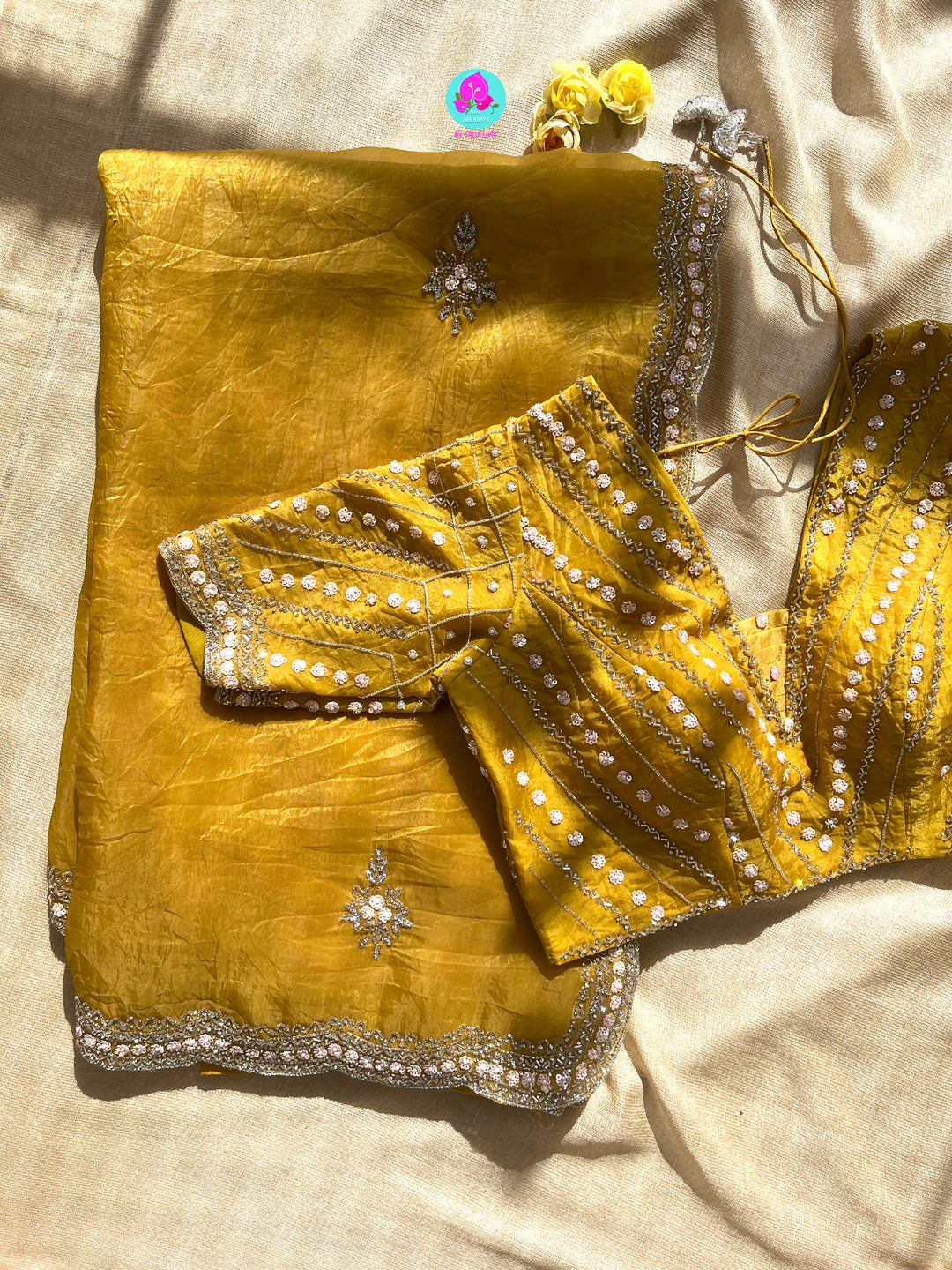 Crushed satin silk saree with sequins embroidery paired with Crushed satin sequins blouse