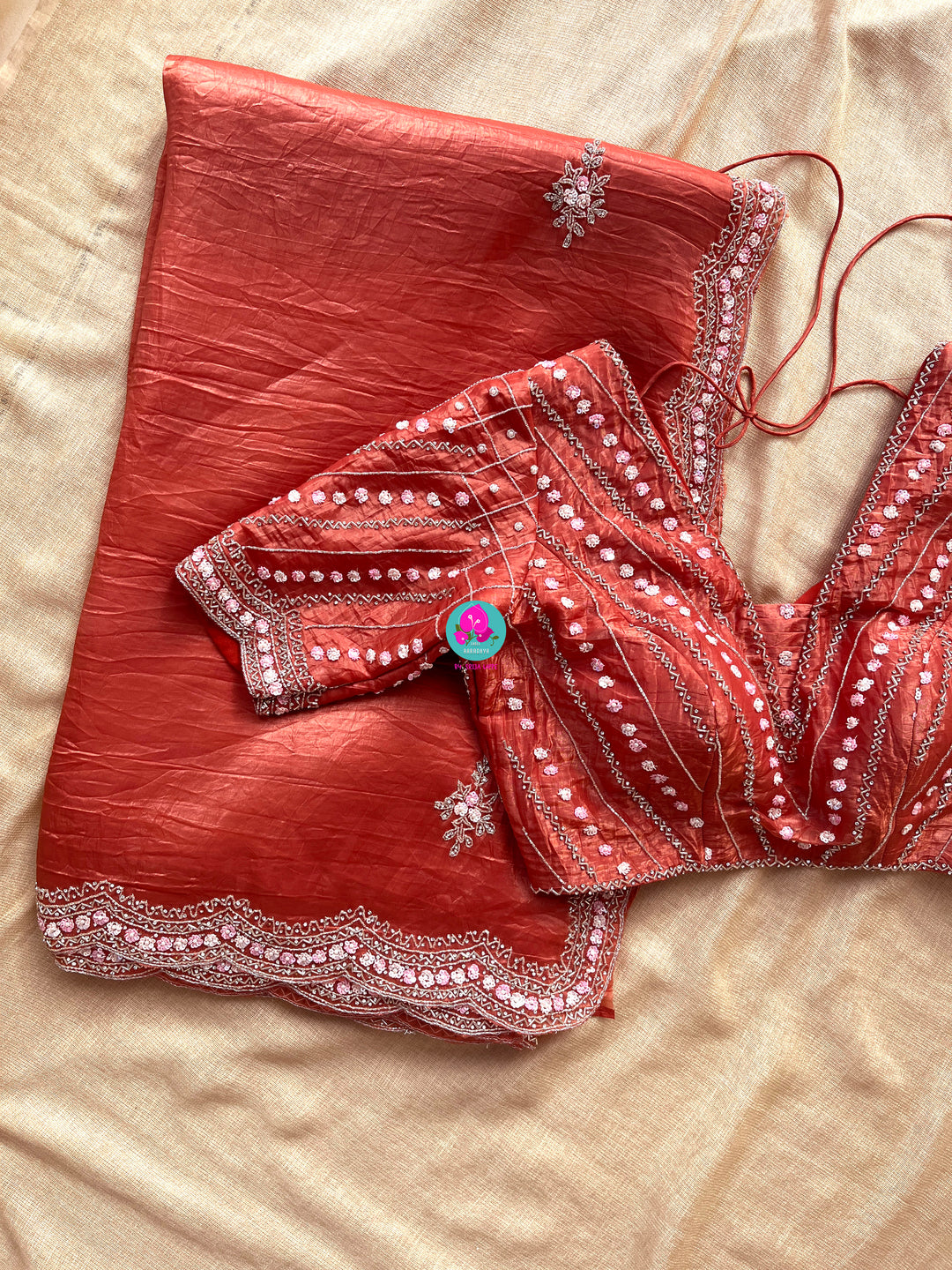 Crushed satin silk saree with sequins embroidery paired with Crushed satin sequins blouse