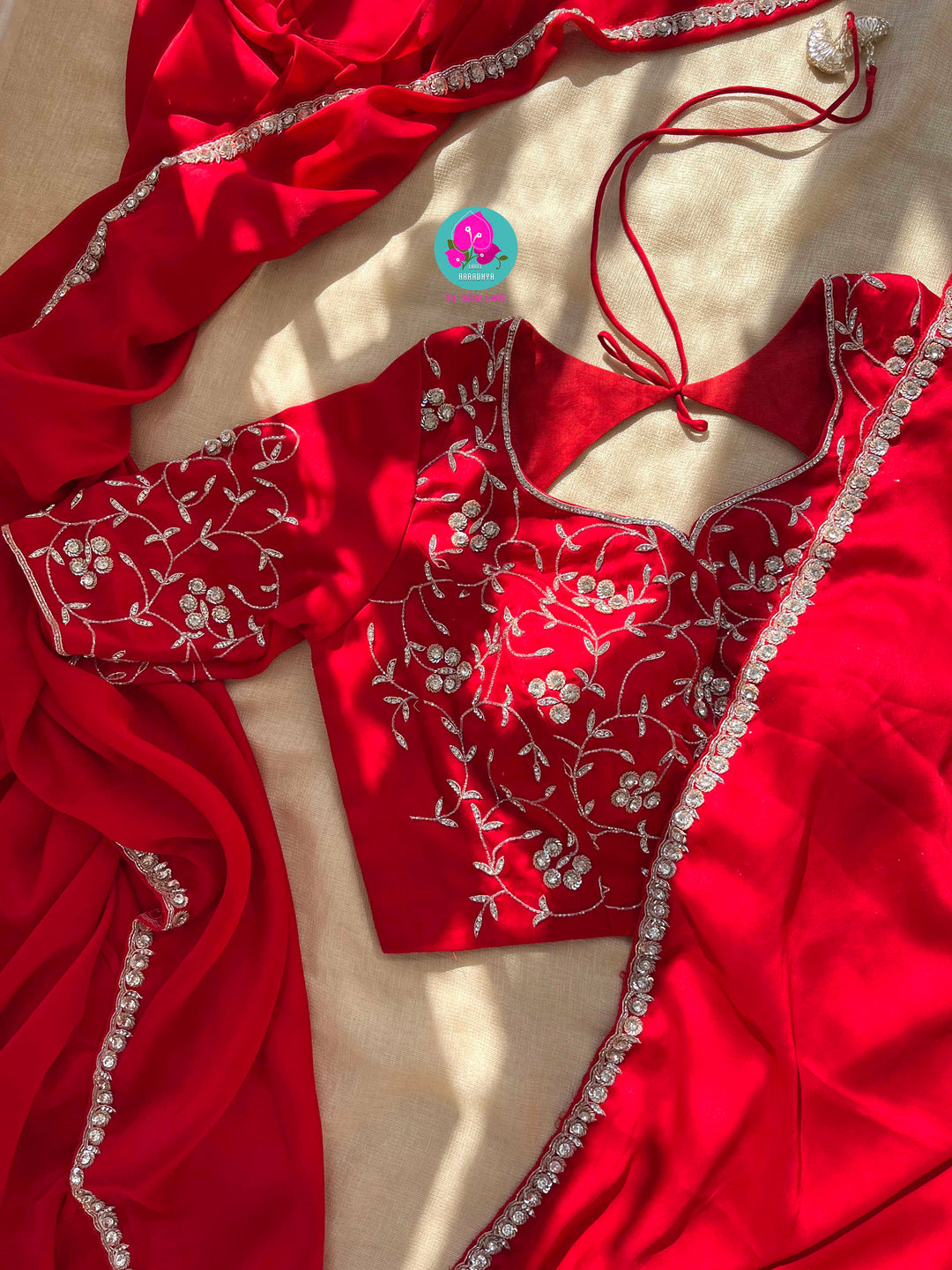 The Passionate Drape: Lustrous Red Satin with Shimmering Silver Work