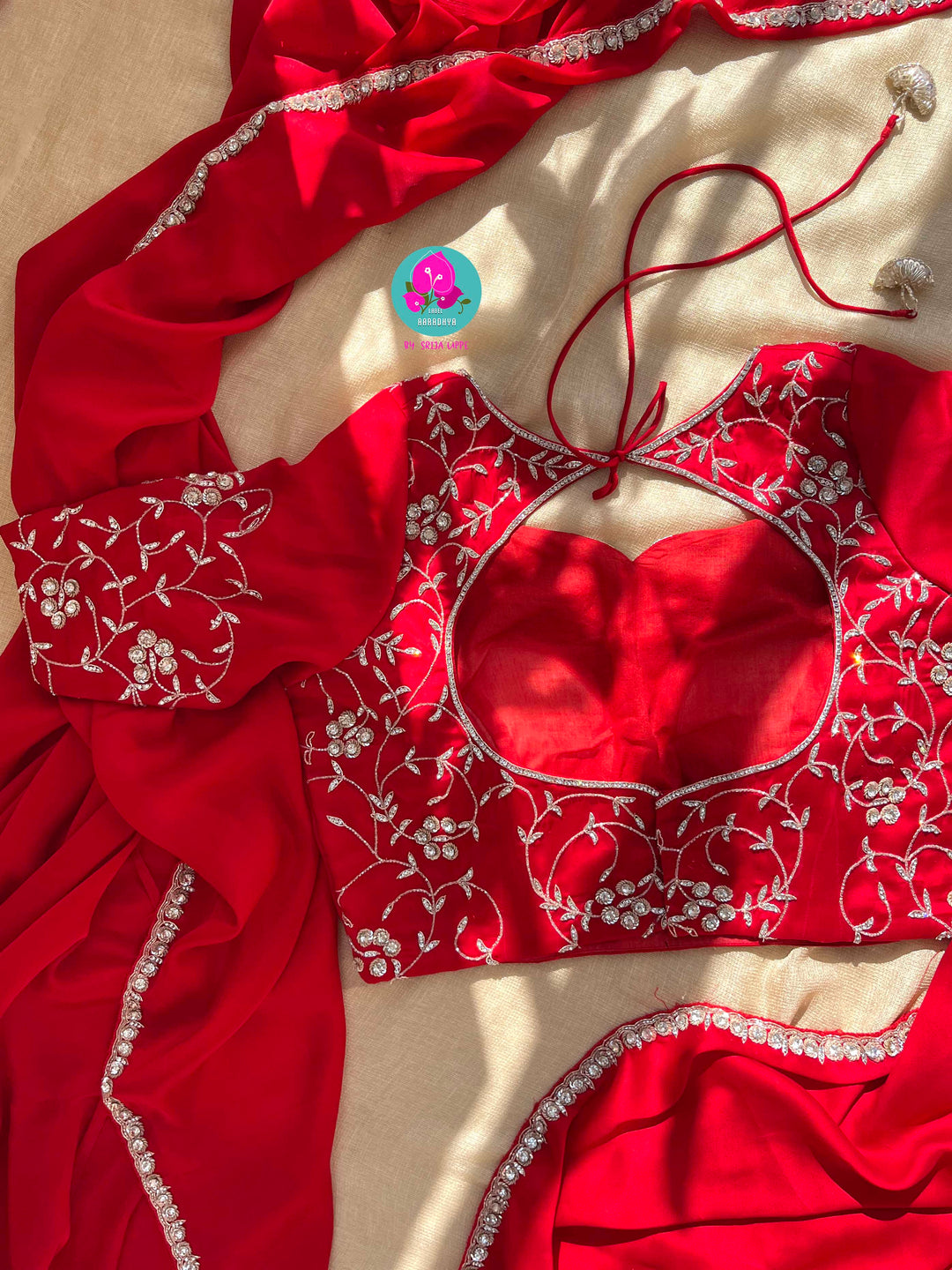 The Passionate Drape: Lustrous Red Satin with Shimmering Silver Work