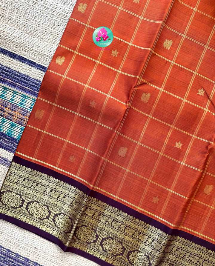 Vintage Earth Elegance: Rust Orange Checkered Kanchipattu Saree with Chocolate Brown Accents