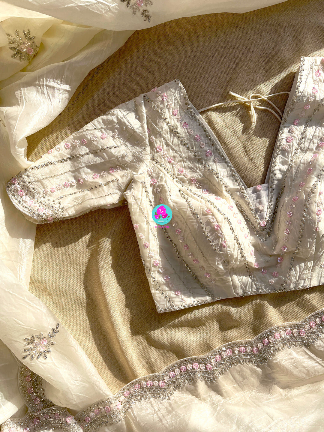 Crushed satin silk saree with sequins embroidery paired with Crushed satin sequins blouse