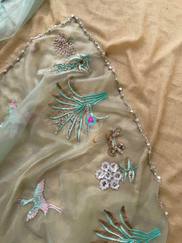 Featherlight Fantasy: Aqua Organza Saree with Embroidered Birds and Sequin Bloom