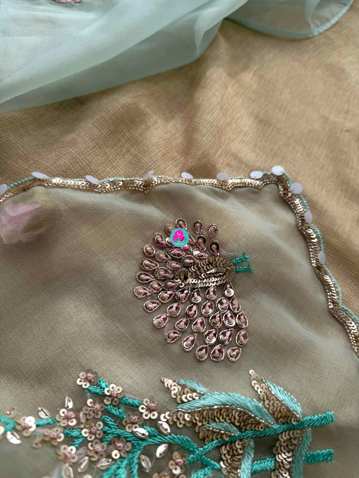Featherlight Fantasy: Aqua Organza Saree with Embroidered Birds and Sequin Bloom