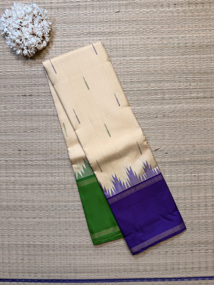 Ganga Jamuna border with rain drop weave & Ikkat Kanjivaram in Ivory, Green, and Royal Purple