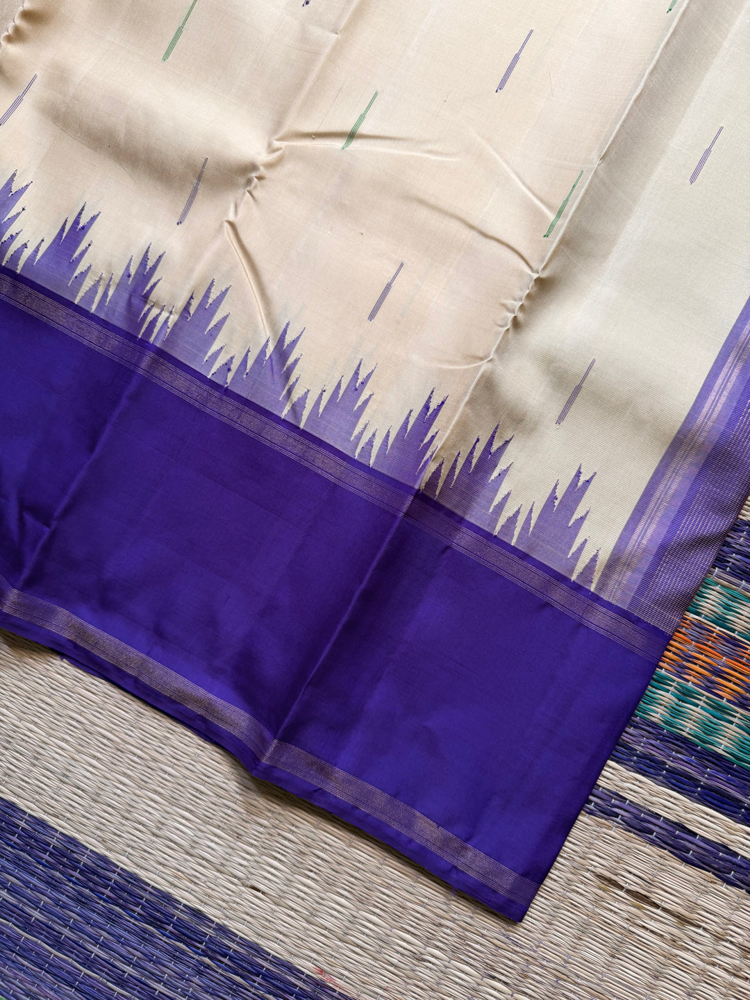 Ganga Jamuna border with rain drop weave & Ikkat Kanjivaram in Ivory, Green, and Royal Purple