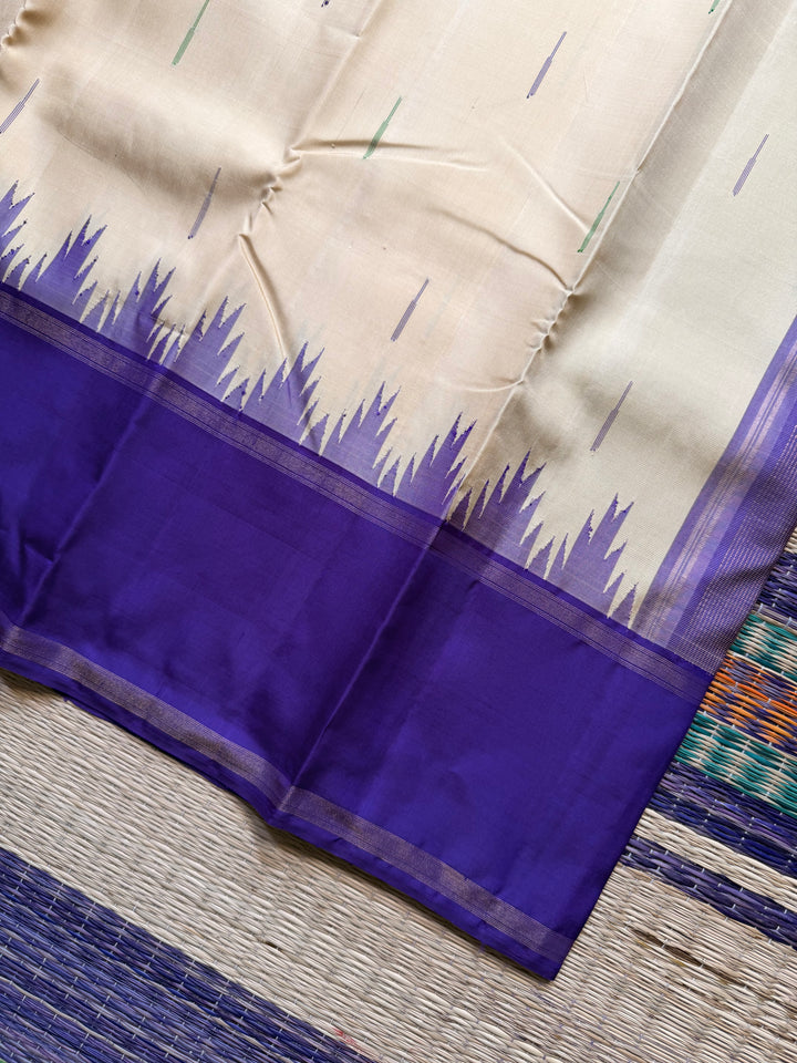 Ganga Jamuna border with rain drop weave & Ikkat Kanjivaram in Ivory, Green, and Royal Purple