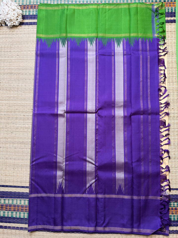 Ganga Jamuna border with rain drop weave & Ikkat Kanjivaram in Ivory, Green, and Royal Purple