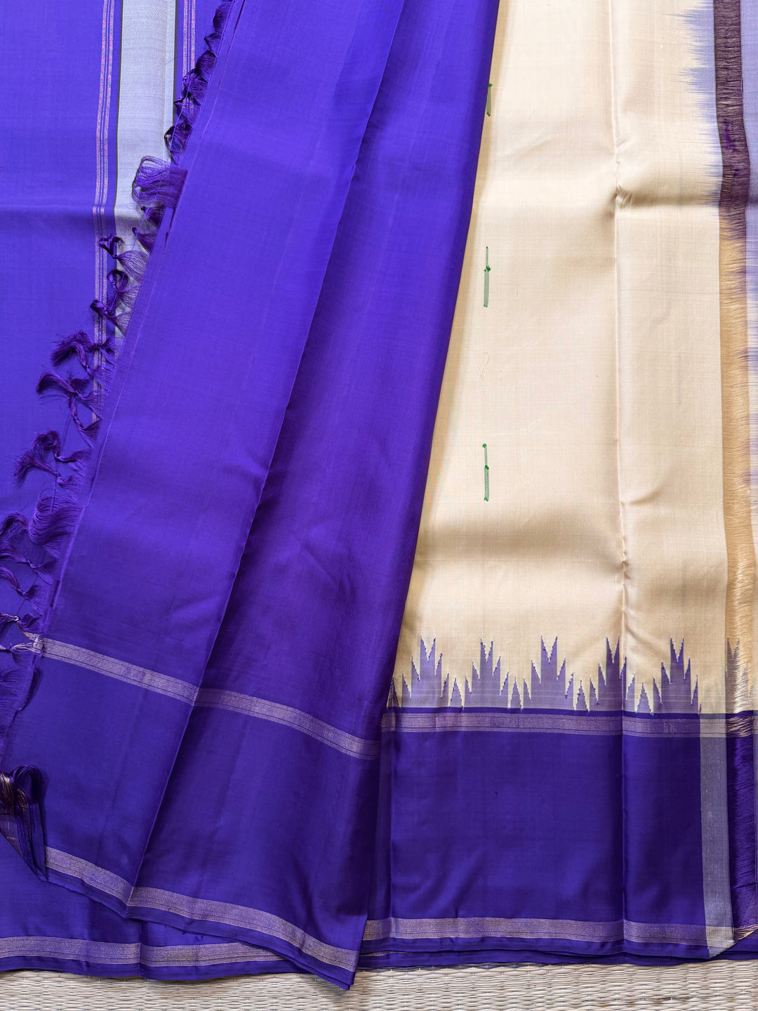 Ganga Jamuna border with rain drop weave & Ikkat Kanjivaram in Ivory, Green, and Royal Purple