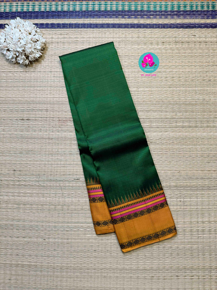 Minimalist Grandeur: Bottle Green Kanjivaram with Striking Mustard Contrast