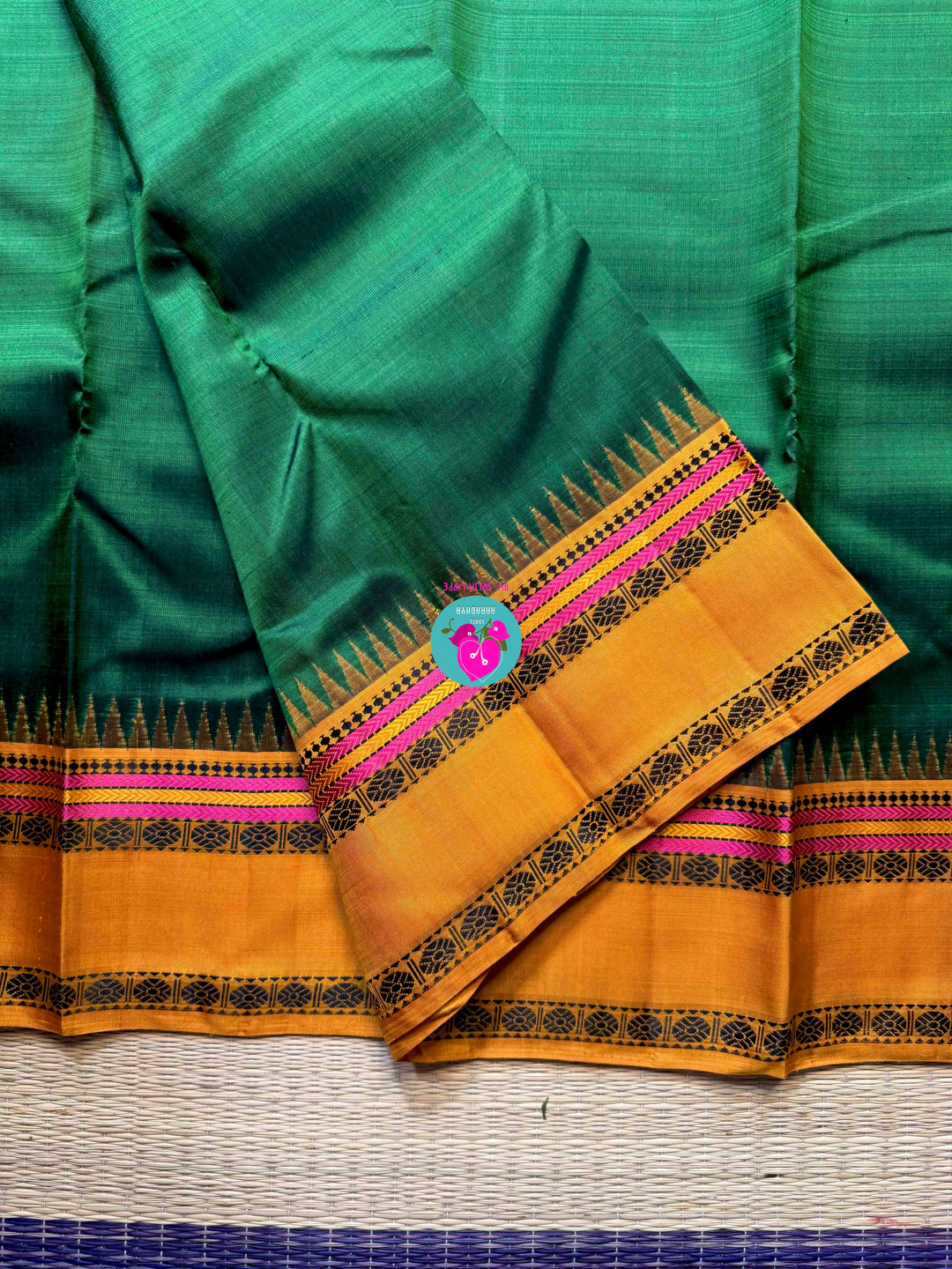 Minimalist Grandeur: Bottle Green Kanjivaram with Striking Mustard Contrast