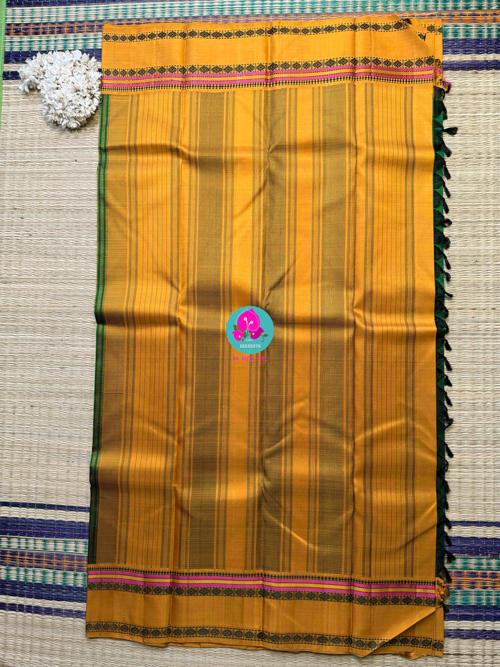 Minimalist Grandeur: Bottle Green Kanjivaram with Striking Mustard Contrast