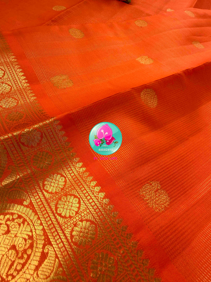 Radiant Solar Crest: Orange Vaira Oosi Kanchipattu Saree with Hand-Embroidered Gandaberunda Art