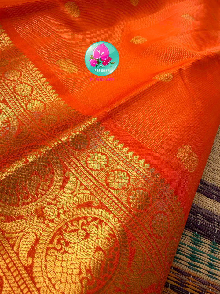 Radiant Solar Crest: Orange Vaira Oosi Kanchipattu Saree with Hand-Embroidered Gandaberunda Art
