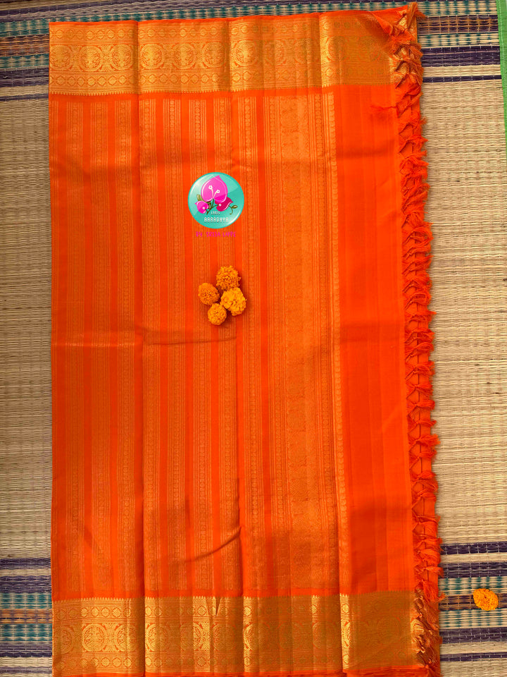 Radiant Solar Crest: Orange Vaira Oosi Kanchipattu Saree with Hand-Embroidered Gandaberunda Art