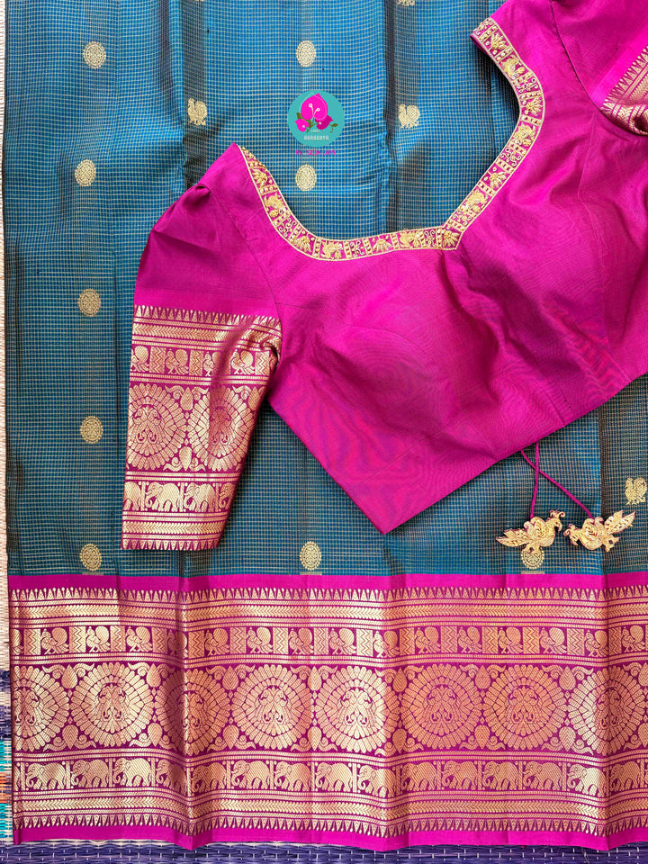Pure Kanchipattu treasure in Teal Green and Magenta color paired with hand embroidered blouse