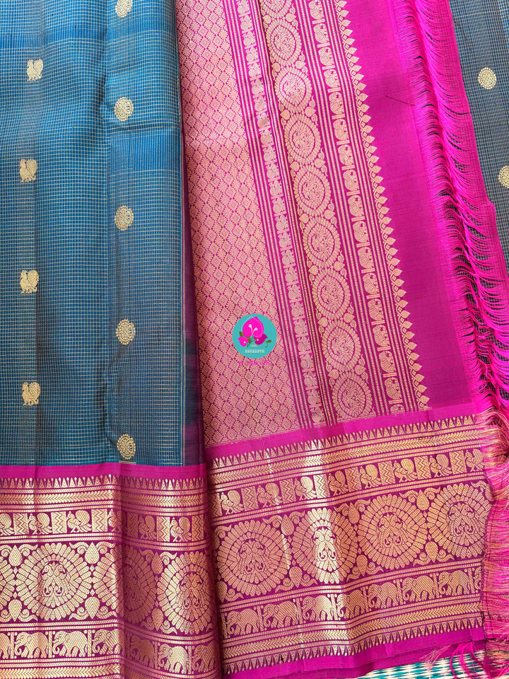 Pure Kanchipattu treasure in Teal Green and Magenta color paired with hand embroidered blouse