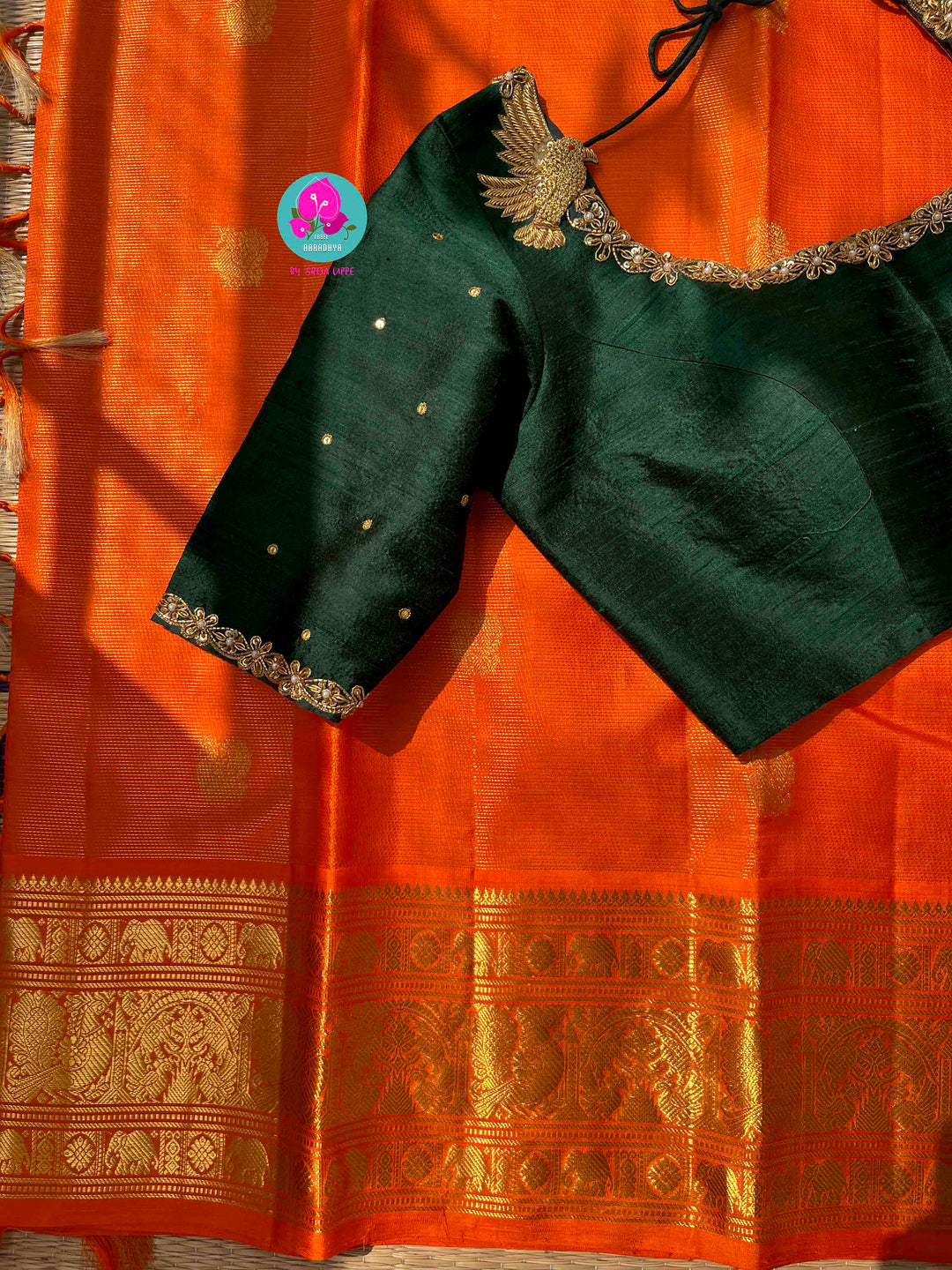 Pure Kanchipattu 3g zari Vaira oosi design on beautiful orange color paired with hand embroidered pure rawsilk blouse