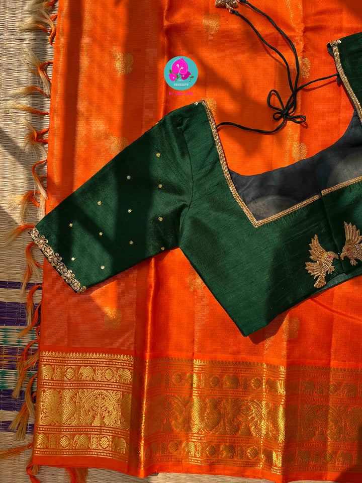 Pure Kanchipattu 3g zari Vaira oosi design on beautiful orange color paired with hand embroidered pure rawsilk blouse