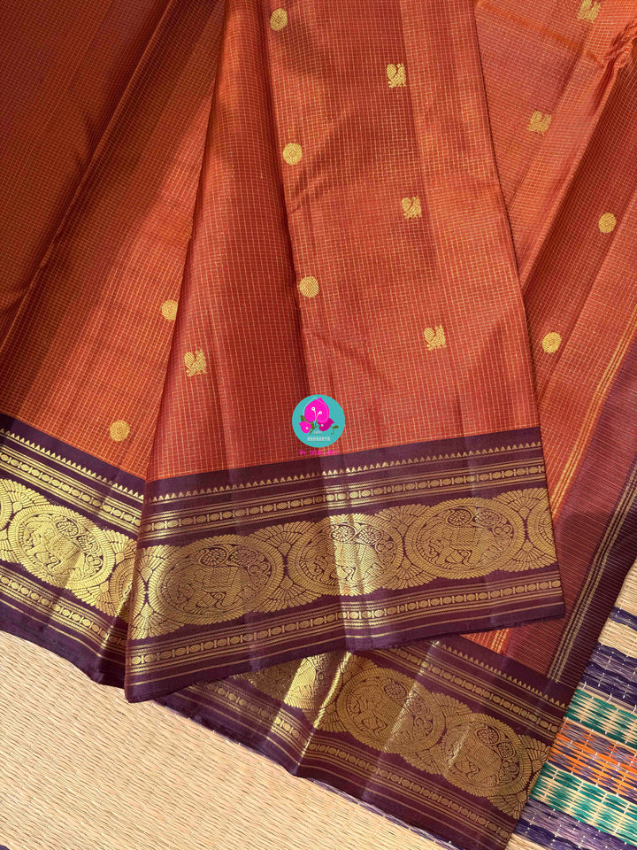 Ember & Amethyst: Rust Orange Kanchipattu Saree with Vintage purplish brown Border