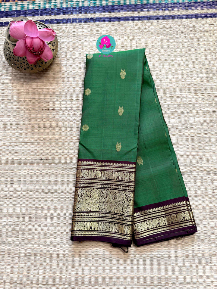 Traditional big border Kanchipattu handloom saree in Green and brown