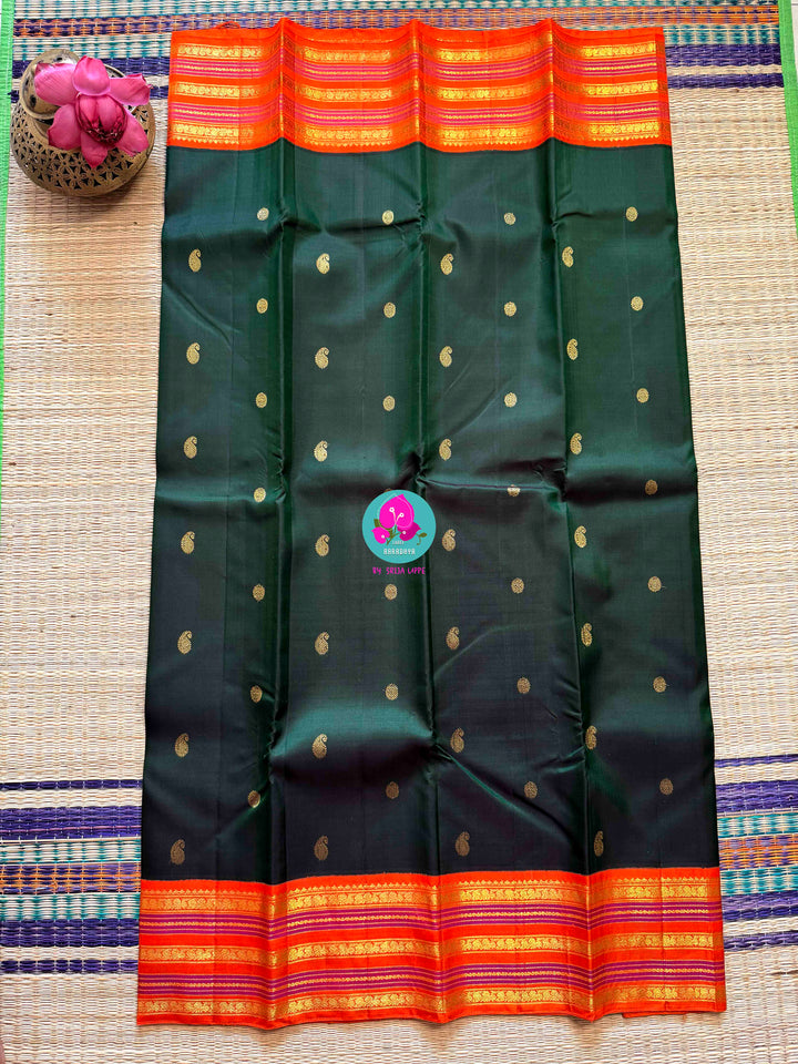 The Classic Contrast: Kanjivaram Silk Saree in Deep Green and Vibrant Orange