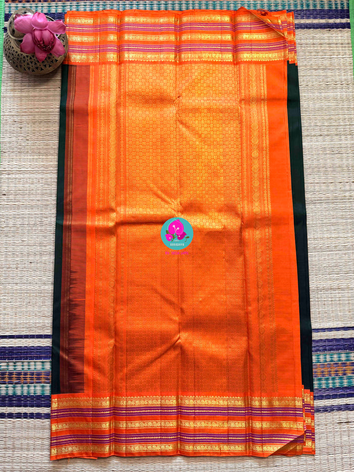 The Classic Contrast: Kanjivaram Silk Saree in Deep Green and Vibrant Orange