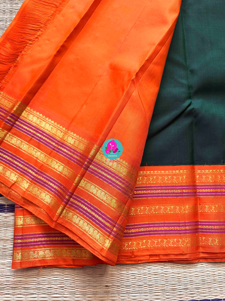 The Classic Contrast: Kanjivaram Silk Saree in Deep Green and Vibrant Orange