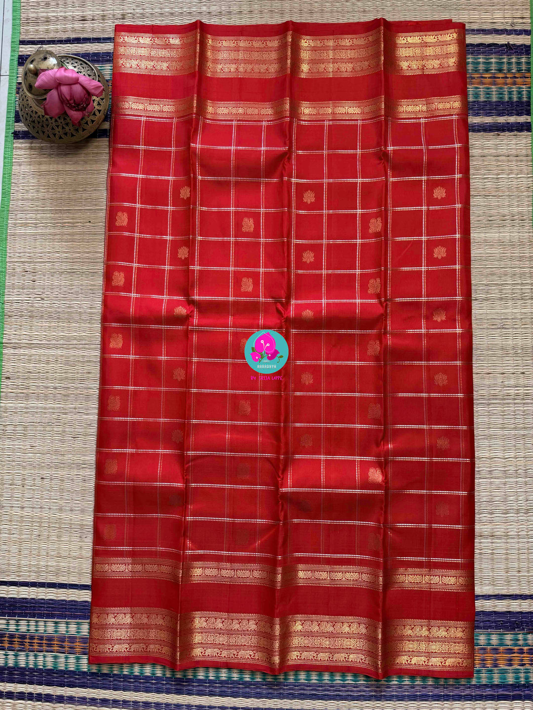 SareeThe Crimson Treasure: Timeless Red Silk Saree with Elegant Zari Weave