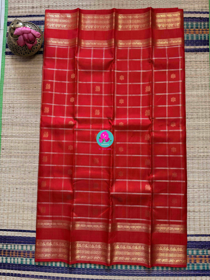 SareeThe Crimson Treasure: Timeless Red Silk Saree with Elegant Zari Weave