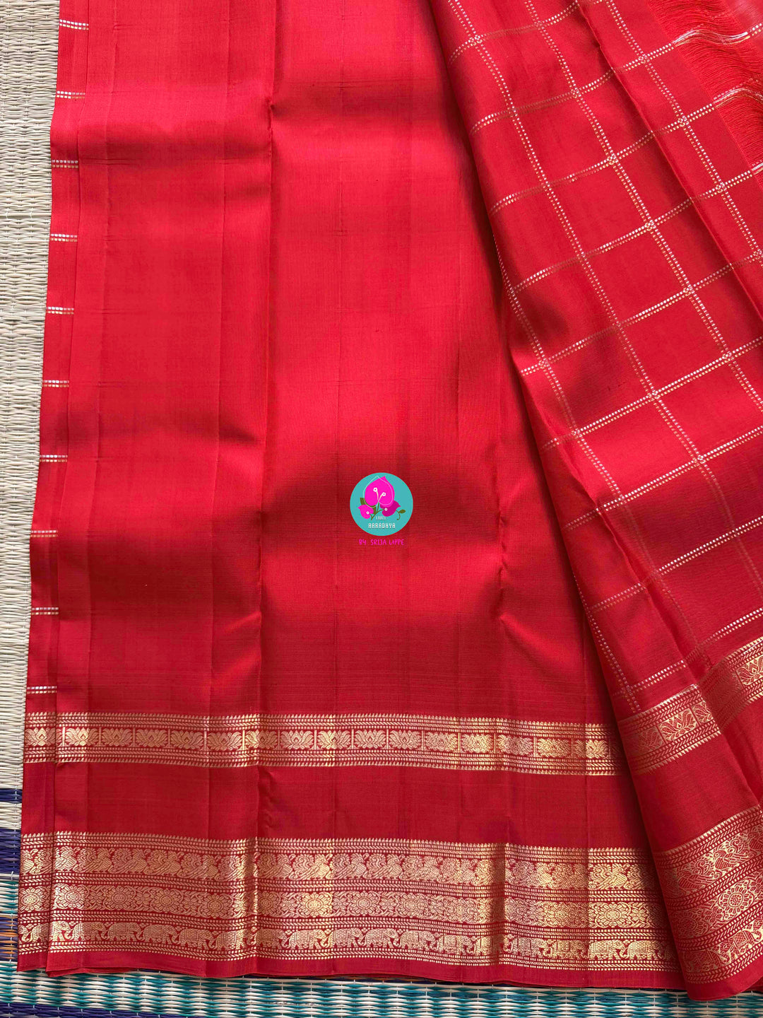 SareeThe Crimson Treasure: Timeless Red Silk Saree with Elegant Zari Weave