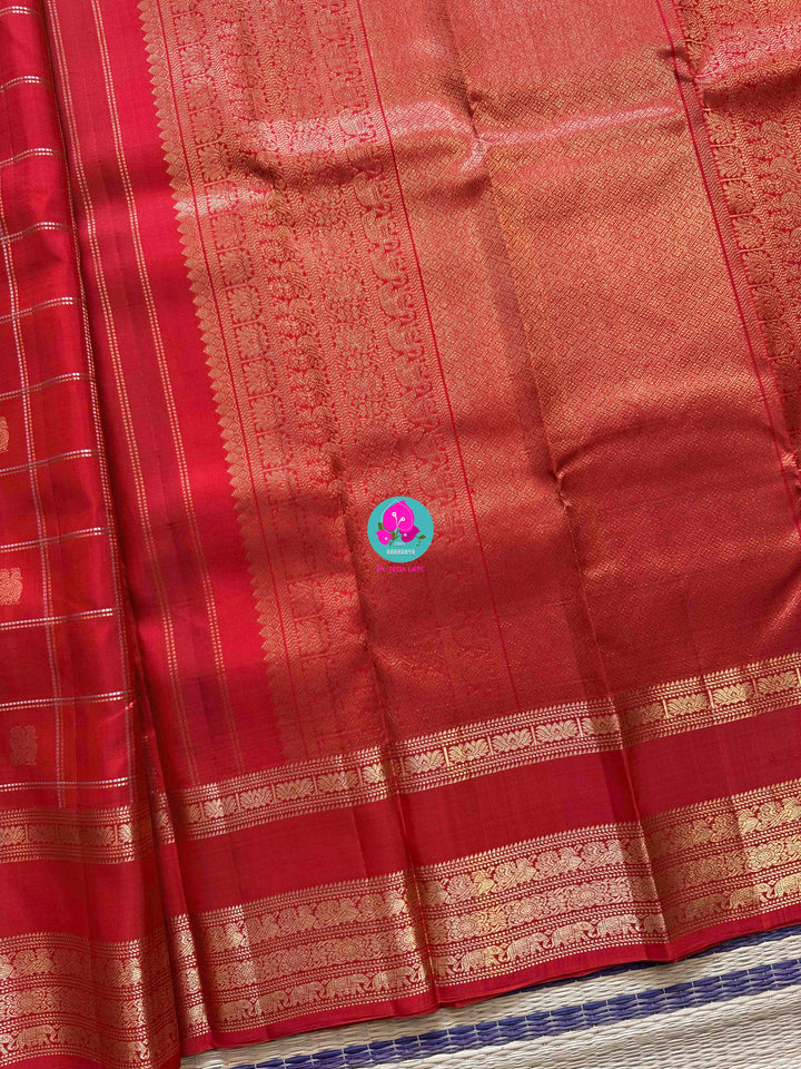 SareeThe Crimson Treasure: Timeless Red Silk Saree with Elegant Zari Weave