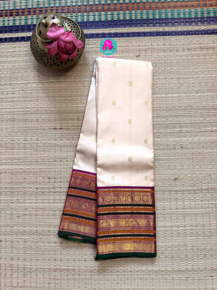 Jewel Tones: Offwhite Kanjivaram Saree with mix of Bright magenta, green & mustard Contrast border