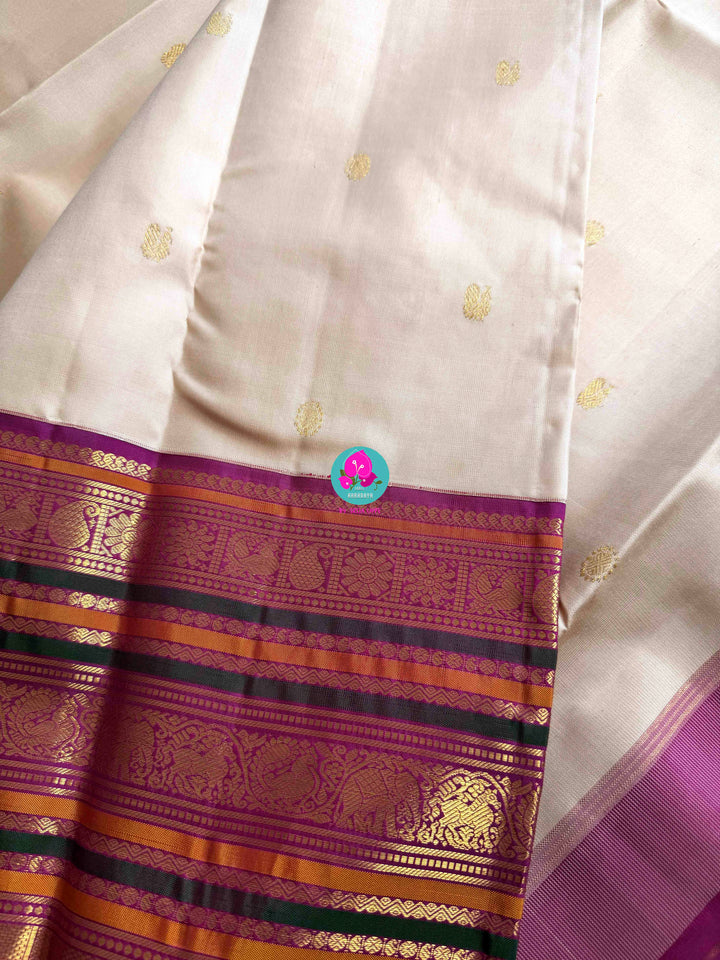 Jewel Tones: Offwhite Kanjivaram Saree with mix of Bright magenta, green & mustard Contrast border