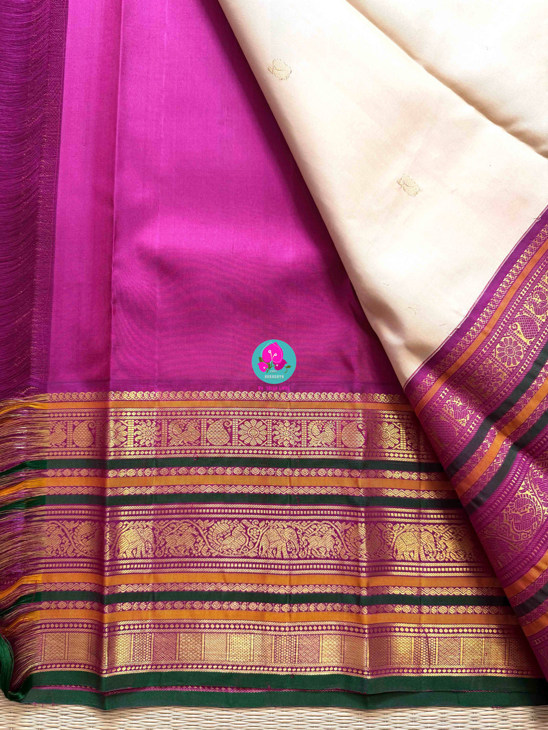 Jewel Tones: Offwhite Kanjivaram Saree with mix of Bright magenta, green & mustard Contrast border