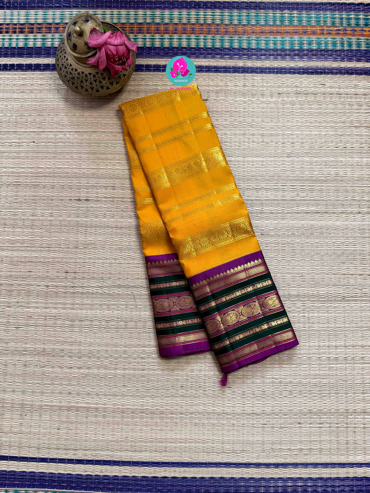 The 3G Zari Grandeur: Vintage Yellow Saree with Forest Green & Purple Edge