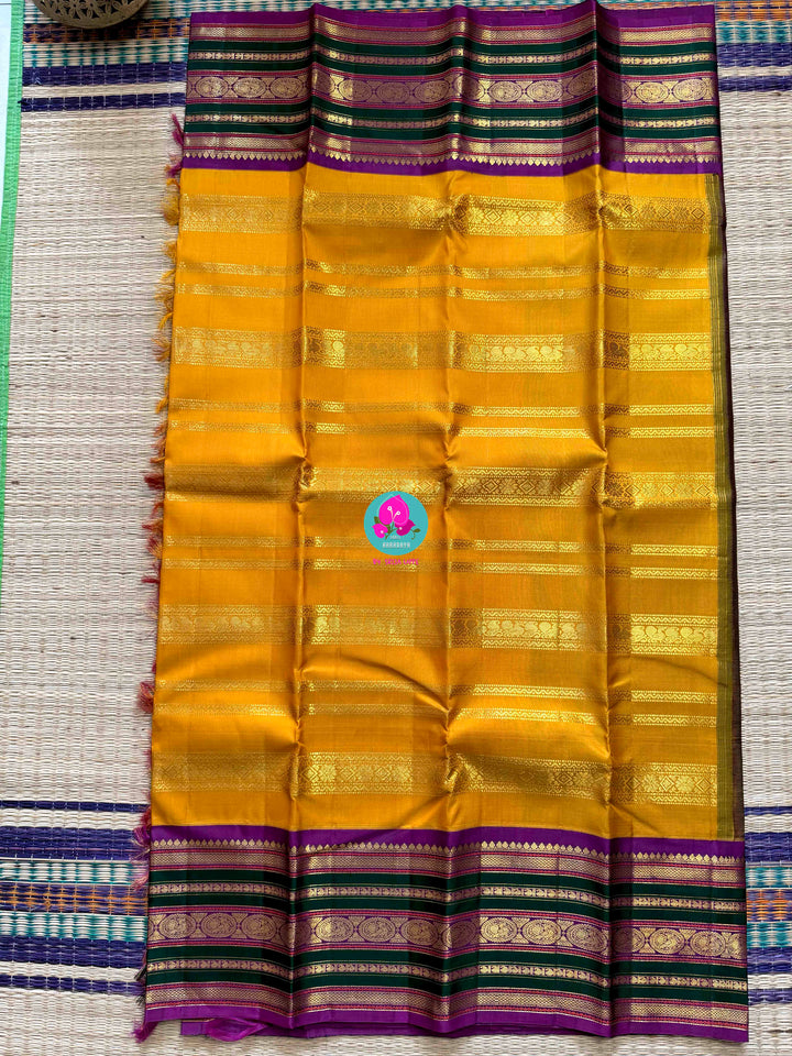The 3G Zari Grandeur: Vintage Yellow Saree with Forest Green & Purple Edge