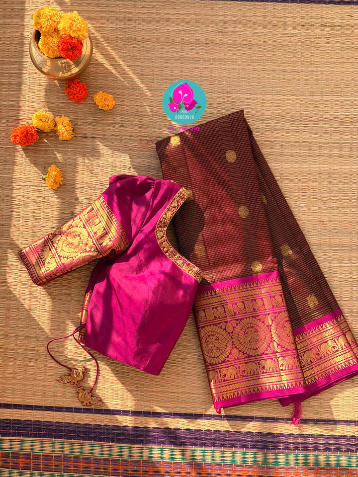 Pure Kanchipattu treasure in deep brown and Magenta color paired with hand embroidered blouse